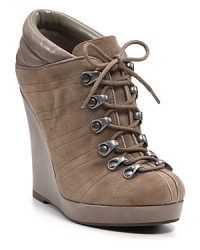 Sleek suede wedges take hiking boot styling for a trek through the urban jungle. By Aqua. Sleek suede wedges take hiking boot styling for a trek through the urban jungle. By Aqua.