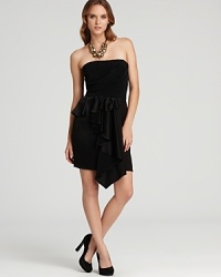 Thoughtful details like gorgeous draping and feminine ruffles make this ABS by Allen Schwartz strapless dress a stunning standout. Thoughtful details like gorgeous draping and feminine ruffles make this ABS by Allen Schwartz strapless dress a stunning standout.