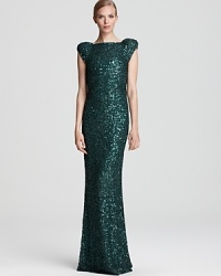 Turn around in this show-stopping ABS by Allen Schwartz sequin gown to reveal a sultry open back. Turn around in this show-stopping ABS by Allen Schwartz sequin gown to reveal a sultry open back.