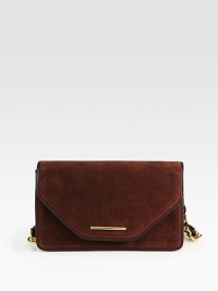 Soft suede trimmed in luxurious leather with a radiant chain strap.Chain and leather shoulder strap, 10 dropMagnetic flap closureProtective metal feetThree inner compartmentsOne inside zip pocketTwo inside open pocketsFully lined5½W X 9½H X 2DImported Soft suede trimmed in luxurious leather with a radiant chain strap.Chain and leather shoulder strap, 10 dropMagnetic flap closureProtective metal feetThree inner compartmentsOne inside zip pocketTwo inside open pocketsFully lined5½W X 9½H X 2DImported