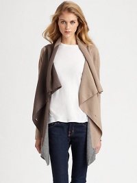 Neutral, lightweight and draped, this lengthy cashmere sweater is an essential piece for every season. Draped button frontLong sleevesAsymmetrical cropped back hemAbout 33 from shoulder to hem at longest pointCashmereDry cleanImportedModel shown is 5'11 (178cm) wearing US size Small. Neutral, lightweight and draped, this lengthy cashmere sweater is an essential piece for every season. Draped button frontLong sleevesAsymmetrical cropped back hemAbout 33 from shoulder to hem at longest pointCashmereDry cleanImportedModel shown is 5'11 (178cm) wearing US size Small.
