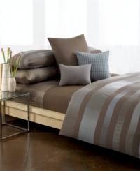 This woven matelasse coverlet from Calvin Klein makes a luxe addition to your bed in soft and sophisticated combed cotton. This woven matelasse coverlet from Calvin Klein makes a luxe addition to your bed in soft and sophisticated combed cotton.
