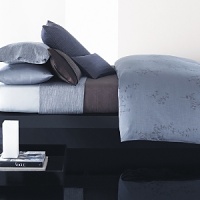 Delicate fronds in plum and pewter on a muted textured background. In 280-thread count combed cotton sateen. Imported. Delicate fronds in plum and pewter on a muted textured background. In 280-thread count combed cotton sateen. Imported.