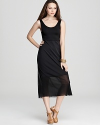 This season is all about playing with proportion, and this VINCE CAMUTO dress embodies the trend in a body-skimming short tank silhouette with a fluttering longer sheer overlay. This season is all about playing with proportion, and this VINCE CAMUTO dress embodies the trend in a body-skimming short tank silhouette with a fluttering longer sheer overlay.