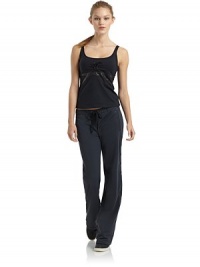 THE LOOKScoop neckline with lace-up frontAdjustable shoulder strapsTextured geometric appliquésInterior shelf braTHE FITAbout 19 from shoulder to hemTHE MATERIALBody: nylon/spandexContrast: polyester/spandexCARE & ORIGINMachine washMade in USAModel shown is 5'8 (172½cm) wearing US size Small. THE LOOKScoop neckline with lace-up frontAdjustable shoulder strapsTextured geometric appliquésInterior shelf braTHE FITAbout 19 from shoulder to hemTHE MATERIALBody: nylon/spandexContrast: polyester/spandexCARE & ORIGINMachine washMade in USAModel shown is 5'8 (172½cm) wearing US size Small.