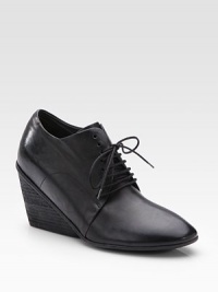 Traditional leather silhouette enhanced by an on-trend wedge and convenient lace-up front. Stacked wedge, 3 (75mm) Leather upper Leather lining and sole Made in ItalyOUR FIT MODEL RECOMMENDS ordering true size. Traditional leather silhouette enhanced by an on-trend wedge and convenient lace-up front. Stacked wedge, 3 (75mm) Leather upper Leather lining and sole Made in ItalyOUR FIT MODEL RECOMMENDS ordering true size.