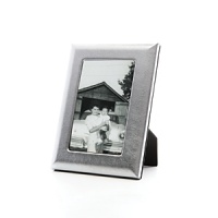 Supple fine Italian leather wraps this handcrafted frame in true luxury. A sturdy easel and easy access to photos makes it equal parts form and function. Supple fine Italian leather wraps this handcrafted frame in true luxury. A sturdy easel and easy access to photos makes it equal parts form and function.