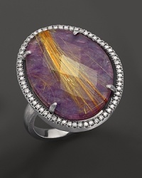 Diamonds circle a faceted rutilated quartz and purple charoite doublet in a sterling silver band. By Di Massima. Diamonds circle a faceted rutilated quartz and purple charoite doublet in a sterling silver band. By Di Massima.