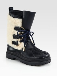 A seasonal leather staple with plush shearling trim and metal-tipped laces. Rubber heel, 1 (25mm)Shaft, 9Leg circumference, 12Leather and shearling upperPull-on styleShearling liningRubber trek solePadded insoleImported