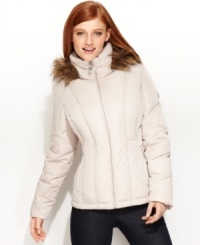 Streamlined vertical quilting gives Calvin Klein's short puffer coat a trim silhouette, while a faux-fur-trimmed hood adds a luxe touch. Streamlined vertical quilting gives Calvin Klein's short puffer coat a trim silhouette, while a faux-fur-trimmed hood adds a luxe touch.