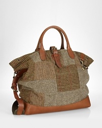 Evoking the aesthetic of vintage fishing bags, a timeless silhouette is lent modern polish from a patchwork tweed construction with leather accents. Evoking the aesthetic of vintage fishing bags, a timeless silhouette is lent modern polish from a patchwork tweed construction with leather accents.