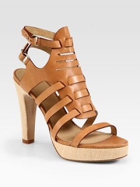 Natural straw heel and platform lift an intertwining leather upper with adjustable ankle straps. Straw heel, 4½ (115mm)Straw platform, 1 (25mm)Compares to a 3½ heel (90mm)Leather upperLeather lining and solePadded insoleImportedOUR FIT MODEL RECOMMENDS ordering one size up as this style runs small. Natural straw heel and platform lift an intertwining leather upper with adjustable ankle straps. Straw heel, 4½ (115mm)Straw platform, 1 (25mm)Compares to a 3½ heel (90mm)Leather upperLeather lining and solePadded insoleImportedOUR FIT MODEL RECOMMENDS ordering one size up as this style runs small.