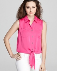 Whether you choose to layer it or wear it on its own, the satin finish and color-charged hue of this VINCE CAMUTO blouse is bound to captivate. Whether you choose to layer it or wear it on its own, the satin finish and color-charged hue of this VINCE CAMUTO blouse is bound to captivate.