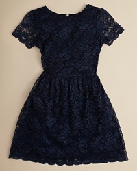 Dress her up in this classic lace dress with sheer sleeves. Dress her up in this classic lace dress with sheer sleeves.