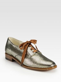 Traditional oxford rejuvenated by lustrous metallic leather and oversized laces. Metallic leather and lurex upperLeather lining and solePadded insoleMade in France Traditional oxford rejuvenated by lustrous metallic leather and oversized laces. Metallic leather and lurex upperLeather lining and solePadded insoleMade in France