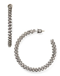 Prepare to be hypnotized by these studded hoop earrings from Aqua. In shapely silver, this pair of sparklers promises to give every look spellbinding appeal. Prepare to be hypnotized by these studded hoop earrings from Aqua. In shapely silver, this pair of sparklers promises to give every look spellbinding appeal.