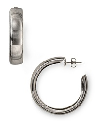 R.J. Graziano puts a textured spin on the classic hoop earrings. Wear this silver-plated pair to add understated shine to every look. R.J. Graziano puts a textured spin on the classic hoop earrings. Wear this silver-plated pair to add understated shine to every look.