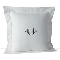 A solid pique throw pillow with a hemstitch border and embroidered navy monogram adds classic style. A solid pique throw pillow with a hemstitch border and embroidered navy monogram adds classic style.