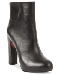 Look at that heel. Boutique 9's Tana platform booties feature a snake-embossed covered leather heel that contrasts excellently against the sexy suede upper. Look at that heel. Boutique 9's Tana platform booties feature a snake-embossed covered leather heel that contrasts excellently against the sexy suede upper.
