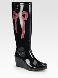 A pretty bow brightens this rainy day essential made of durable PVC, resting on an elevated platform wedge. Rubber wedge, 3 (75mm)Rubber platform, 1 (25mm)Compares to a 2 heel (50mm)Shaft, 14Leg circumference, 15PVC upperPull-on styleNylon liningRubber solePadded insoleMade in Italy A pretty bow brightens this rainy day essential made of durable PVC, resting on an elevated platform wedge. Rubber wedge, 3 (75mm)Rubber platform, 1 (25mm)Compares to a 2 heel (50mm)Shaft, 14Leg circumference, 15PVC upperPull-on styleNylon liningRubber solePadded insoleMade in Italy