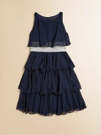 A spectacular frock in airy chiffon with tiers of ruffles and a glittery belted waist.BoatneckSleevelessback keyhole buttonElastic belted waistbandFull skirtRuffled hemFully linedPolyesterDry cleanMade in the USA of imported fabric A spectacular frock in airy chiffon with tiers of ruffles and a glittery belted waist.BoatneckSleevelessback keyhole buttonElastic belted waistbandFull skirtRuffled hemFully linedPolyesterDry cleanMade in the USA of imported fabric