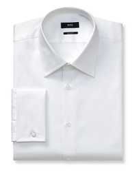 Slightly trimmer than regular fit, button front long-sleeved shirt. Voluminous Kent collar. French cuffs. Flat back yoke with no pleats. Clean front, no pocket. Rounded hem. Textured solid. Slightly trimmer than regular fit, button front long-sleeved shirt. Voluminous Kent collar. French cuffs. Flat back yoke with no pleats. Clean front, no pocket. Rounded hem. Textured solid.