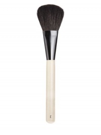Oversized brush of luxurious goat hair with a small handle for effortless storage and transportation. Designed for face powder and bronzer. Made in USA. Oversized brush of luxurious goat hair with a small handle for effortless storage and transportation. Designed for face powder and bronzer. Made in USA.
