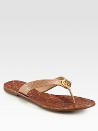 Puzzle-print footbed joined by a croc-print leather thong and goldtone designer medallion. Croc-print leather upperLeather liningRubber soleImportedOUR FIT MODEL RECOMMENDS ordering true size. 