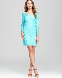Delicate lace lends romantic inspiration to a classic Lilly Pulitzer dress, finished with sheer sleeves and a scalloped hem for pure feminine charm. Delicate lace lends romantic inspiration to a classic Lilly Pulitzer dress, finished with sheer sleeves and a scalloped hem for pure feminine charm.