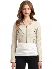 THE LOOKStand collar with jersey panelsFront zip closureLong sleeves with snap cuffsSide zip pocketsElastic waist with snap detailsTHE FITAbout 17 from shoulder to hemCroppedTHE MATERIALLeatherCARE & ORIGINDry clean by a leather specialistImportedOUR FIT MODEL RECOMMENDS ordering one size up as this size runs small. THE LOOKStand collar with jersey panelsFront zip closureLong sleeves with snap cuffsSide zip pocketsElastic waist with snap detailsTHE FITAbout 17 from shoulder to hemCroppedTHE MATERIALLeatherCARE & ORIGINDry clean by a leather specialistImportedOUR FIT MODEL RECOMMENDS ordering one size up as this size runs small.