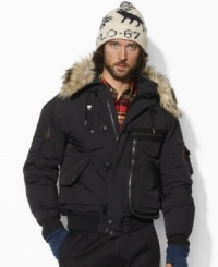 Cover all your cold-weather needs in an essential multi-functional bomber jacket that features multiple utility pockets and a trimmed hood to block out the elements. Cover all your cold-weather needs in an essential multi-functional bomber jacket that features multiple utility pockets and a trimmed hood to block out the elements.