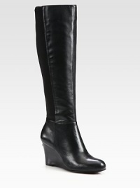 This sleek leather design is freshened with comfortable stretch paneling and a stacked wedge. Stacked wedge, 3 (75mm)Shaft, 16Leg circumference, 13Leather upper with stretch fabric panelSide zipLeather liningRubber solePadded insoleImported This sleek leather design is freshened with comfortable stretch paneling and a stacked wedge. Stacked wedge, 3 (75mm)Shaft, 16Leg circumference, 13Leather upper with stretch fabric panelSide zipLeather liningRubber solePadded insoleImported