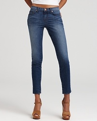 These J Brand skinny jeans flaunt a hip-hugging rise and artful fading.