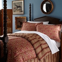 A traditional floral paisley pattern in hues of red and gold reverse to a bold stripe. Comforter and shams feature cord trim. A traditional floral paisley pattern in hues of red and gold reverse to a bold stripe. Comforter and shams feature cord trim.