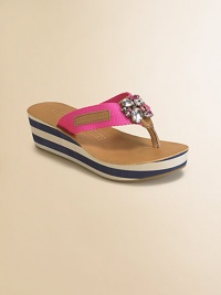 Attractively striped wedge and platform topped with a sparking embellishment in a low-cut thong silhouette.Slip-on styleNylon upperRubber soleImported Attractively striped wedge and platform topped with a sparking embellishment in a low-cut thong silhouette.Slip-on styleNylon upperRubber soleImported