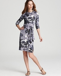 Shades of grey lend drama to an oversized floral print for a Tory Burch dress brimming with dark romance. Shades of grey lend drama to an oversized floral print for a Tory Burch dress brimming with dark romance.