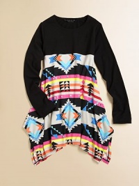 A split, asymmetrical hemmed skirt is complimented by an eye-catching tribal print and topped with a solid shirt for a California cool ensemble.CrewneckLong sleevesPullover styleHigh-waistedSplit asymmetrical hem85% rayon/15% spandexHand washImported A split, asymmetrical hemmed skirt is complimented by an eye-catching tribal print and topped with a solid shirt for a California cool ensemble.CrewneckLong sleevesPullover styleHigh-waistedSplit asymmetrical hem85% rayon/15% spandexHand washImported