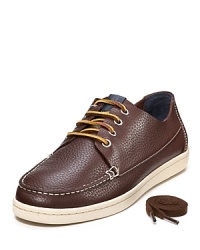 Tumbled leather boat shoe with contrast leather lace-up closure and comfy rubber sole. Tumbled leather boat shoe with contrast leather lace-up closure and comfy rubber sole.