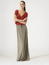 Dramatic draping and a v-back add a dash of demure to this jersey v-neck. V-neckShort sleevesV-backLonger length hits below the hipsRayonDry cleanImportedModel shown is 5'10 (177cm) wearing US size Small. Dramatic draping and a v-back add a dash of demure to this jersey v-neck. V-neckShort sleevesV-backLonger length hits below the hipsRayonDry cleanImportedModel shown is 5'10 (177cm) wearing US size Small.