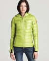 With a down-filled hood and body, this ultra-warm Canada Coose jacket lends added versatility with reflective trimmings and stretch knit accents.