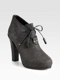 Twin tassels add playful sophistication to this impressive design of waxed suede, finished with leather trim and a commanding stacked heel. Self-covered heel, 4½ (115mm)Hidden platform, 1 (25mm)Compares to a 3½ heel (90mm)Suede upper with leather trim and lacesLeather lining and solePadded insoleMade in Italy Twin tassels add playful sophistication to this impressive design of waxed suede, finished with leather trim and a commanding stacked heel. Self-covered heel, 4½ (115mm)Hidden platform, 1 (25mm)Compares to a 3½ heel (90mm)Suede upper with leather trim and lacesLeather lining and solePadded insoleMade in Italy