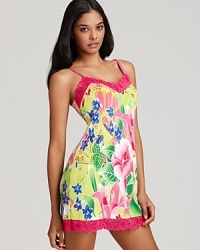 Send your dreams to somewhere tropical in this bright floral print chemise with pretty lace trim. Send your dreams to somewhere tropical in this bright floral print chemise with pretty lace trim.