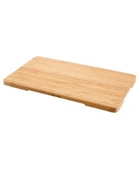 Regain lost counter space with this handy cutting board, crafted in bamboo wood to resist cuts marks and stand the test of time. Great as a cutting board, trivet or serving tray, this versatile essential features heat-resistant feet that stabilize it on top of your toaster oven, so you can slice, dice & prep all in one place. One-year limited warranty. Regain lost counter space with this handy cutting board, crafted in bamboo wood to resist cuts marks and stand the test of time. Great as a cutting board, trivet or serving tray, this versatile essential features heat-resistant feet that stabilize it on top of your toaster oven, so you can slice, dice & prep all in one place. One-year limited warranty.