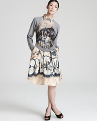 This graffiti-print Jean Paul Gualiter dress proves the line between art and fashion ceases to exist in the eyes of this great designer. Taking style to the streets, this edgy silhouette gets its inspiration from the most organic elements. This graffiti-print Jean Paul Gualiter dress proves the line between art and fashion ceases to exist in the eyes of this great designer. Taking style to the streets, this edgy silhouette gets its inspiration from the most organic elements.