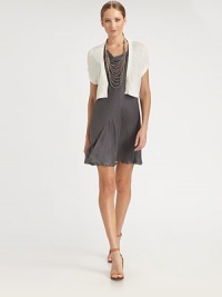 EXCLUSIVELY AT SAKS. Delicate sequins add subtle shimmer to this cropped, knit silhouette.V necklineConcealed snap frontCap sleevesRib-knit hemlineAllover sequinsAbout 18 from shoulder to hem75% linen/25% silkDry cleanMade in ItalyModel shown is 5'11 (180cm) wearing US size Small. EXCLUSIVELY AT SAKS. Delicate sequins add subtle shimmer to this cropped, knit silhouette.V necklineConcealed snap frontCap sleevesRib-knit hemlineAllover sequinsAbout 18 from shoulder to hem75% linen/25% silkDry cleanMade in ItalyModel shown is 5'11 (180cm) wearing US size Small.