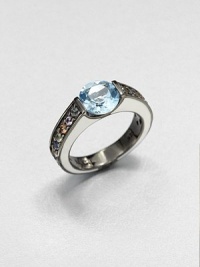A colorful, square-edged band of channel-set sapphires creates a sweet surrounding for a faceted pastel blue topaz.Sapphires and blue topazBlack rhodium-plated sterling silverWidth, about .8Imported A colorful, square-edged band of channel-set sapphires creates a sweet surrounding for a faceted pastel blue topaz.Sapphires and blue topazBlack rhodium-plated sterling silverWidth, about .8Imported