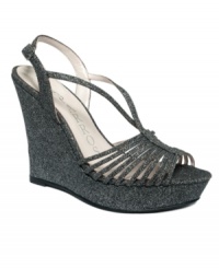 A dusting of glitter transforms the Zuma wedge sandals by Caparros into a sensation worthy of your biggest night out. A dusting of glitter transforms the Zuma wedge sandals by Caparros into a sensation worthy of your biggest night out.