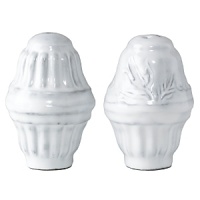Handmade from Venetian terra marrone, or brown clay, this distressed white salt and pepper set brings a sprinkle of rustic sophistication to your table. Handmade from Venetian terra marrone, or brown clay, this distressed white salt and pepper set brings a sprinkle of rustic sophistication to your table.