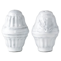 Handmade from Venetian terra marrone, or brown clay, this distressed white salt and pepper set brings a sprinkle of rustic sophistication to your table.