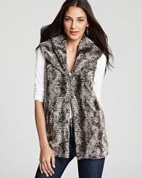 A wide shawl collar lends sumptuous warmth to this Alicia + Olivia faux fur vest, lush and relaxed for every day decadence. A wide shawl collar lends sumptuous warmth to this Alicia + Olivia faux fur vest, lush and relaxed for every day decadence.